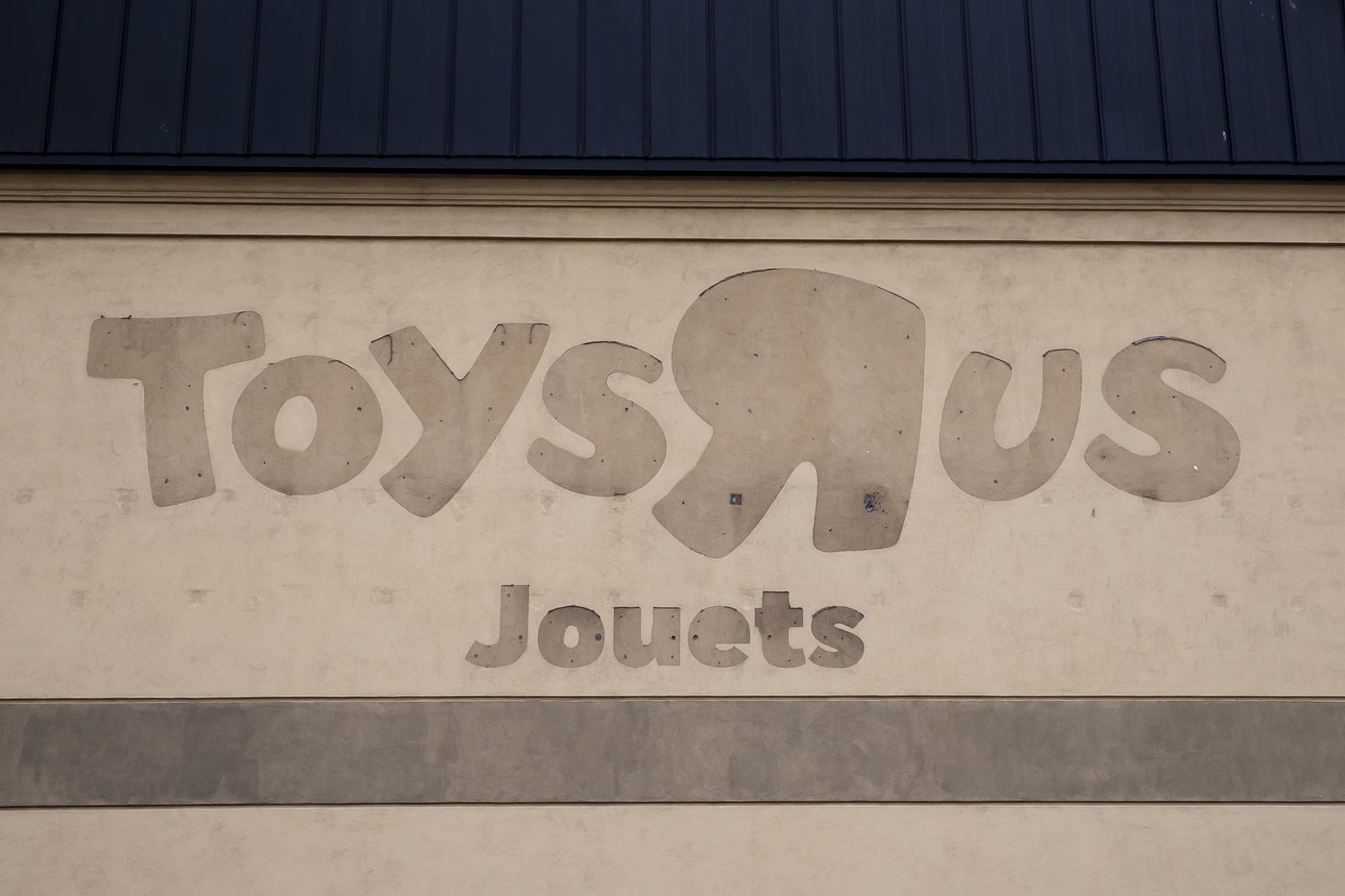 A Toys "R" Us sign at a closed store in Boisbriand, Que., is seen on Monday, March 30, 2026. THE CANADIAN PRESS/Christopher Katsarov