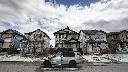 Residents survey the damage before beginning cleanup in Calgary, Alta., Sunday, June 14, 2020, after a major hailstorm damaged homes and flooded streets on Saturday.THE CANADIAN PRESS/Jeff McIntosh