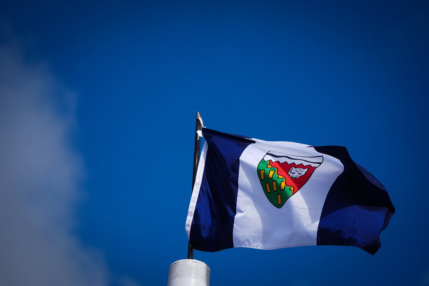 A Northwest Territories flag flies in the wind, in Inuvik, N.W.T., on Thursday, July 24, 2025. THE CANADIAN PRESS/Darryl Dyck