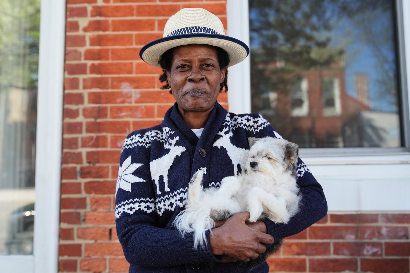 Jevona Anderson, a student at the University of Baltimore, poses for a portrait with her dog, Bella, Tuesday, April 7, 2026, in Baltimore. (AP Photo/Stephanie Scarbrough)