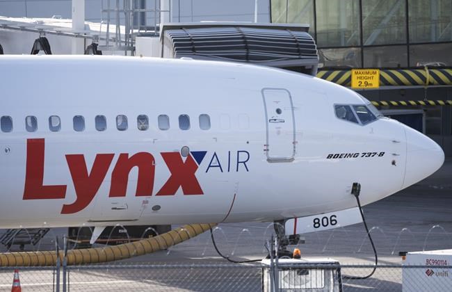 A Lynx Air Boeing 737 jet sits at a gate at the international airport in Calgary on Friday, February 23, 2024. Before its shutdown this week, Lynx Air was planning to pay off at least a big chunk of its debt with a top investor through a purchase by rival discount carrier Flair Airlines. THE CANADIAN PRESS/Todd Korol