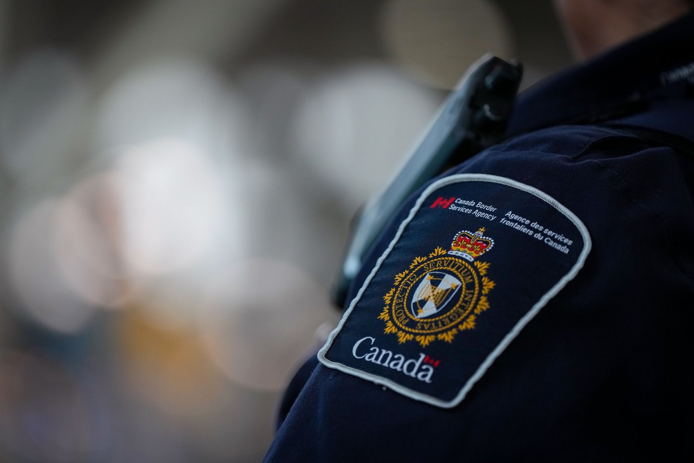 A Canada Border Services Agency patch is seen on the uniform of a CBSA officer at Vancouver International Airport, in Richmond, B.C., on Friday, Oct. 3, 2025. THE CANADIAN PRESS/Darryl Dyck