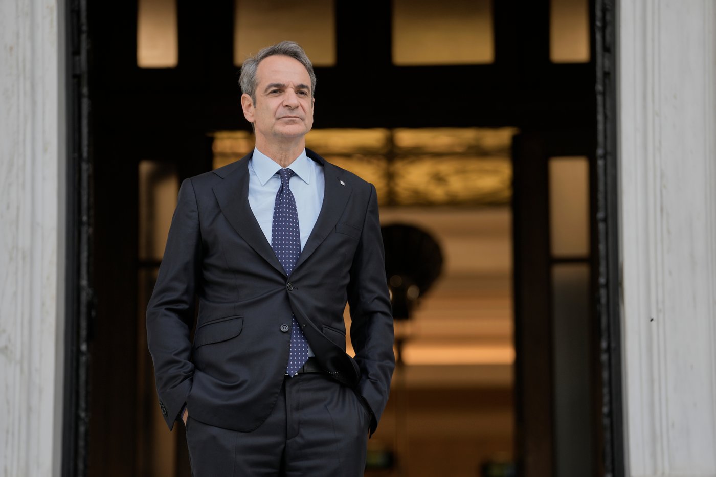 FILE - Greece's Prime Minister Kyriakos Mitsotakis waits for the arrival of the European Parliament president in Athens, April 9, 2025. (AP Photo/Petros Giannakouris)
