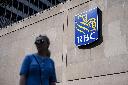 People walk past the Royal Bank Tower in Montreal on Thursday, June 19, 2025. THE CANADIAN PRESS/Christopher Katsarov
