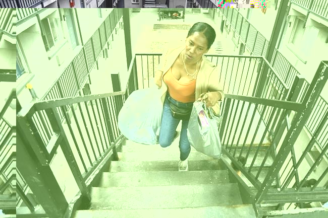 Sofia Roca, a 49-year-old immigrant from Colombia, climbs a stairway inside her apartment complex in Aurora, Colo., on March 29, 2024. (AP Photo/Thomas Peipert)