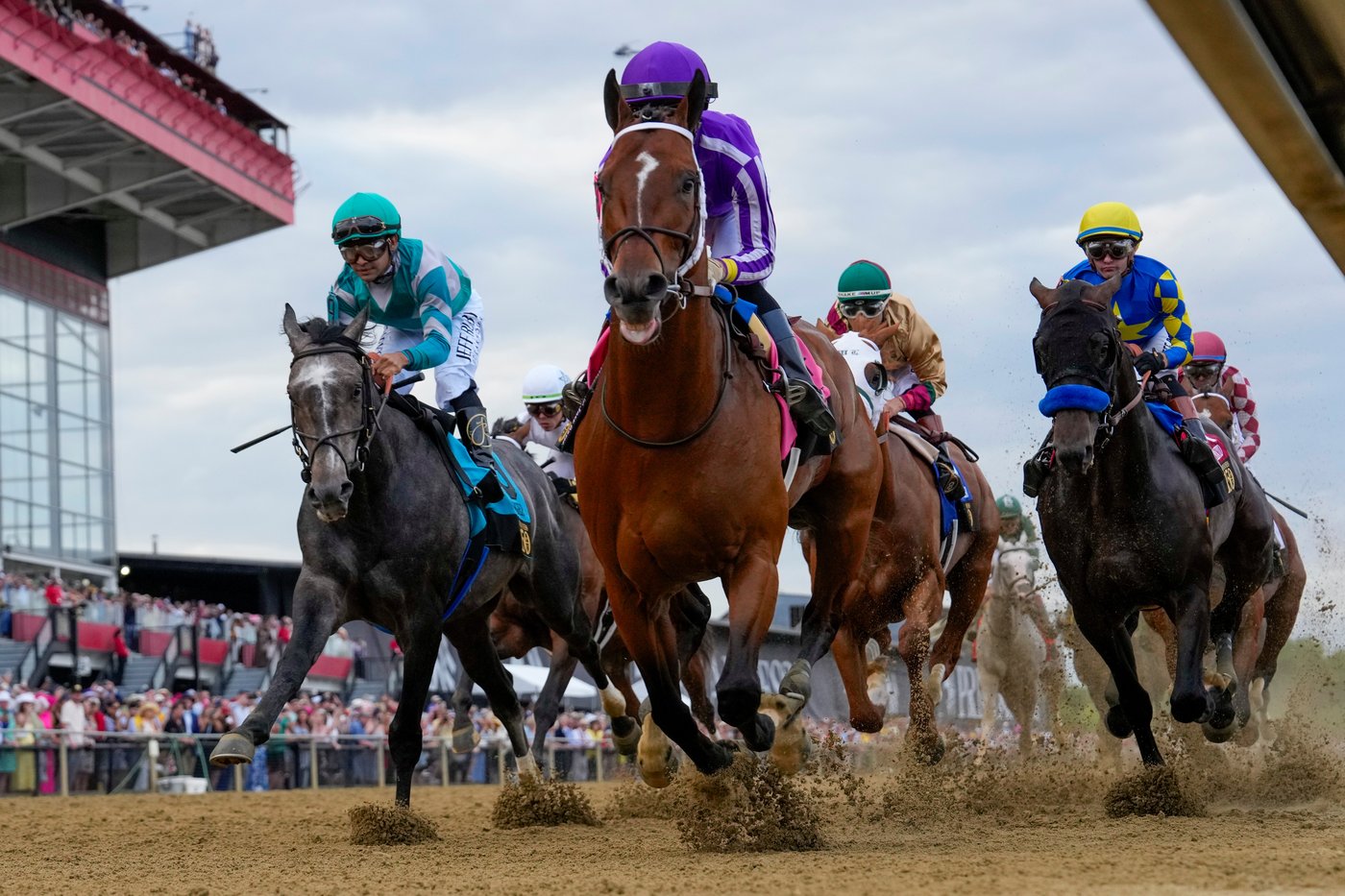 FILE - Jockeys compete during the 150th running of the Preakness Stakes horse race on May 17, 2025, at Pimlico Race Course in Baltimore. (AP Photo/Stephanie Scarbrough, File)