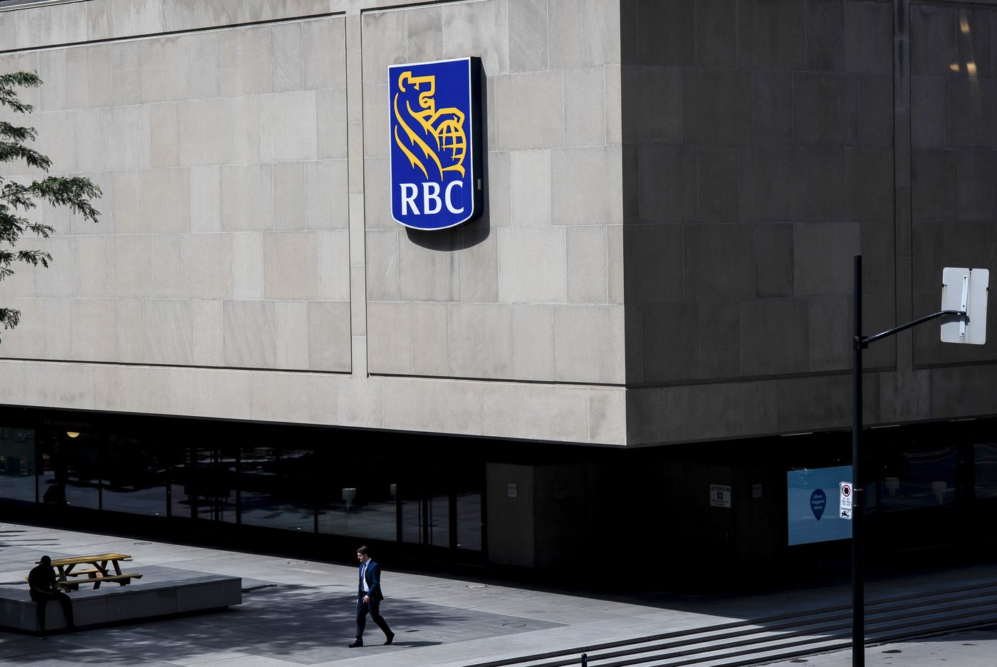 People walk past the Royal Bank Tower in Montreal on Thursday, June 19, 2025. THE CANADIAN PRESS/Christopher Katsarov