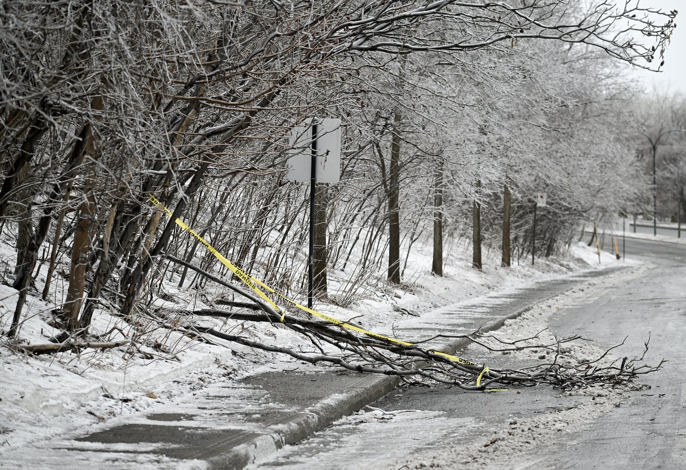 A cross-Canada radio service that for decades has delivered the latest local forecasts as well as critical alerts about severe weather 24 hours a day is signing off, with listeners being advised to switch to online or cellphone-based services. Fallen tree branches are shown on a street in Montreal, Thursday, March 12, 2026, following an ice storm. THE CANADIAN PRESS/Graham Hughes