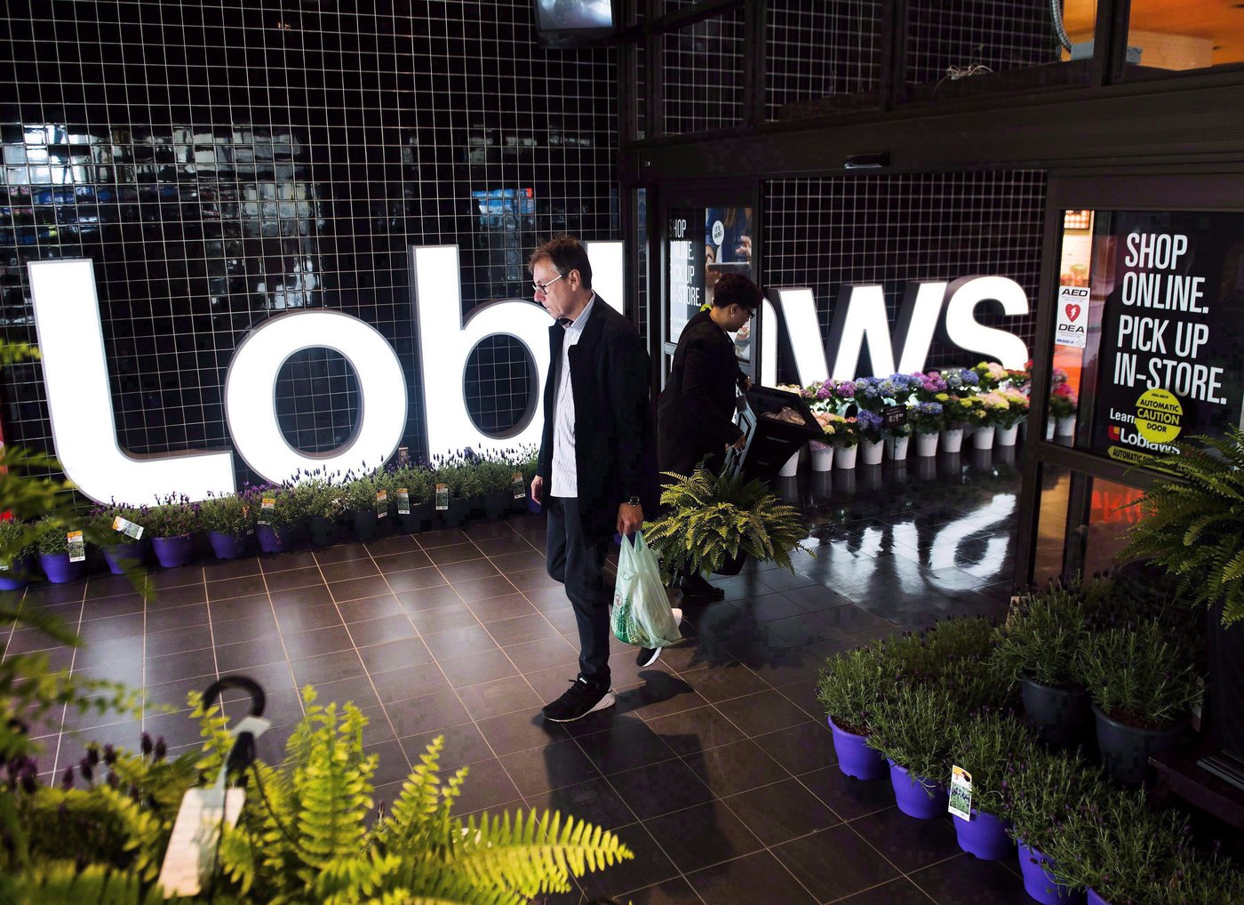 A man leaves a Loblaws store in Toronto on Thursday, May 3, 2018. THE CANADIAN PRESS/Nathan Denette