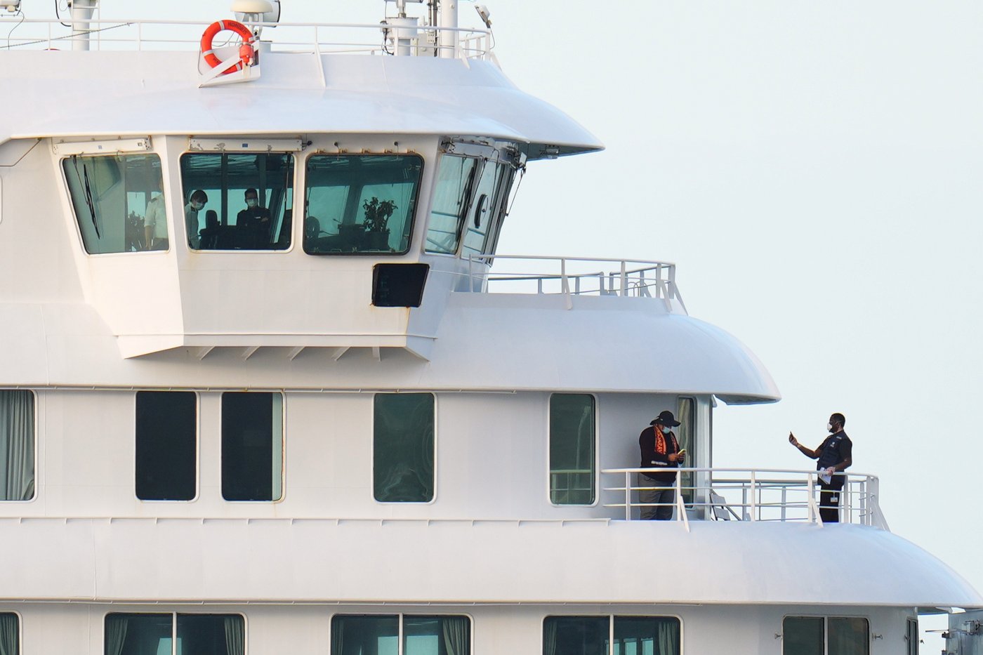 Passengers and crew at the hantavirus-stricken cruise ship MV Hondius after arriving at the port of Granadilla in Tenerife, Canary Islands, Spain, Sunday, May 10, 2026. (AP Photo/Manu Fernandez)