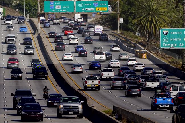 FILE - Cars drive on the Hollywood Freeway (U.S. 101) in Los Angeles, April 16, 2020. New vehicles sold in the U.S. will have to average about 38 miles per gallon of gasoline in 2031 in real world driving, up from about 29 mpg this year, under new federal rules unveiled Friday, June 7, 2024, by the Biden administration. President Joe Biden has set a goal that half all of new vehicles sold in the U.S. in 2030 are electric. (AP Photo/Mark J. Terrill, File)