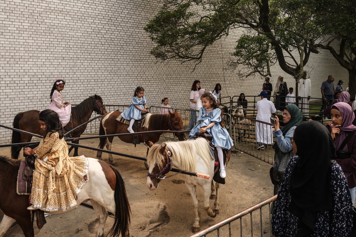Children enjoy a pony ride at the Muslim Association of Canada's Eid Festival in Toronto, on Friday, June 6, 2025. THE CANADIAN PRESS/Chris Young