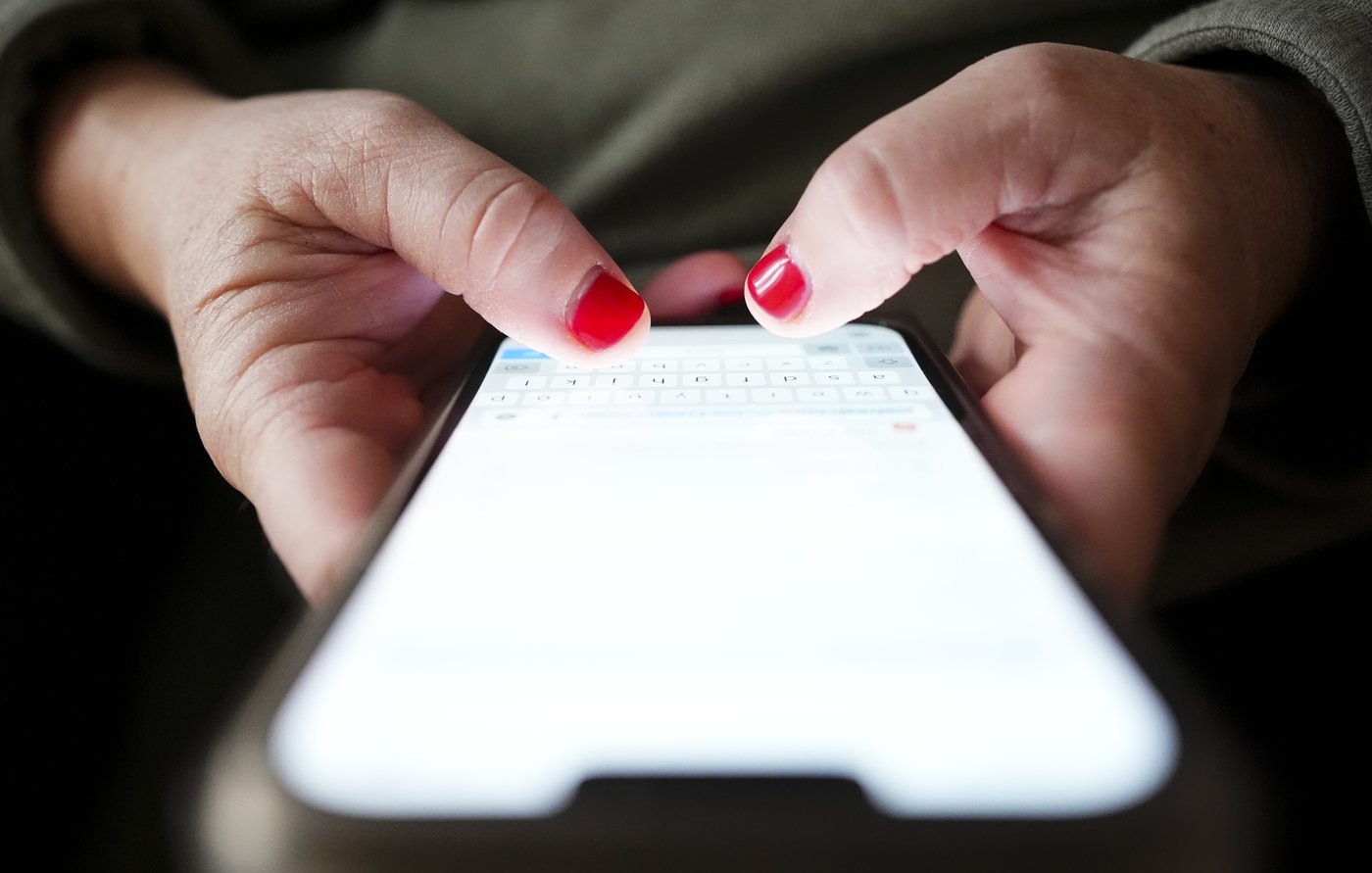 A person types on a cellphone in Ottawa on, Dec. 15, 2025. THE CANADIAN PRESS/Sean Kilpatrick