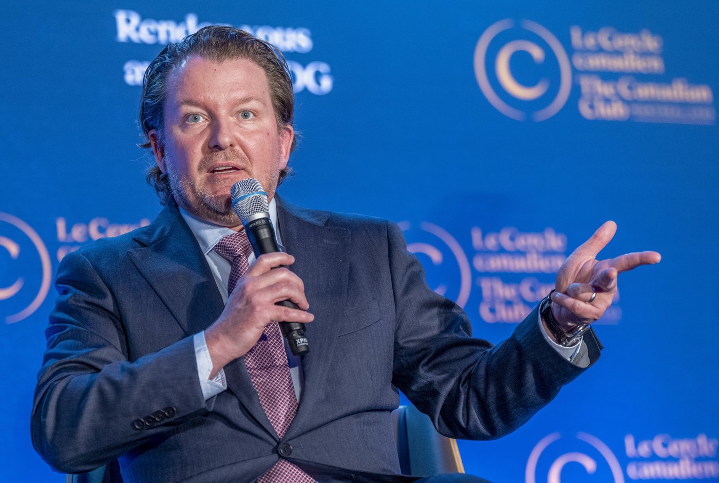 President and CEO of Cogeco Frédéric Perron speaks during a luncheon in Montreal on Monday, May 12, 2025. THE CANADIAN PRESS/Christinne Muschi