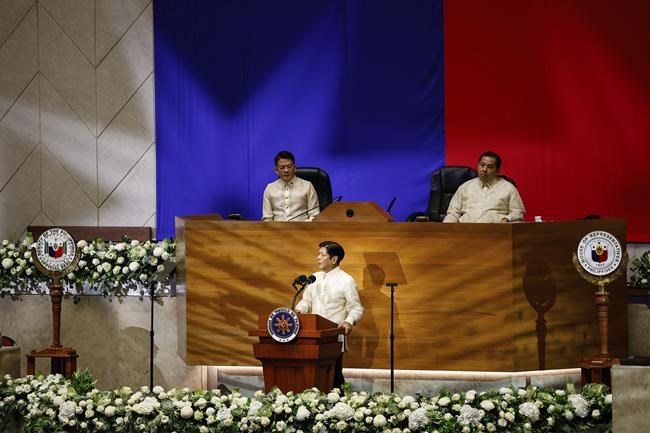 Philippine President Ferdinand Marcos Jr. delivers his third State of the Nation Address as Senate President Francis Escudero, left and House Speaker Martin Romualdez, right, look on at the House of Representatives in Quezon City, Philippines, on Monday, July 22, 2024. (AP Photo/ Gerard V. Carreon)