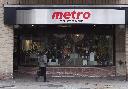A woman walks pass a Metro grocery store in Toronto on Wednesday Nov. 1, 2017. THE CANADIAN PRESS/Doug Ives