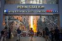 FILE - Commuters pass Penn Station and Madison Square Garden, July 2, 2026, in New York. (Photo by Andy Kropa/Invision/AP, File)