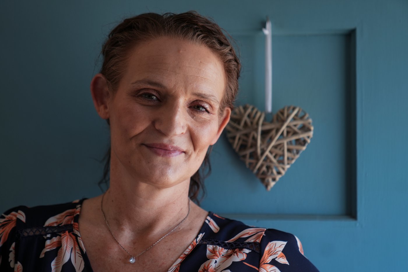 Jessica Thompson, 47, sits for a portrait at her Rockford, Ill., home on Saturday, March 21, 2026. (AP Photo/Erin Hooley)