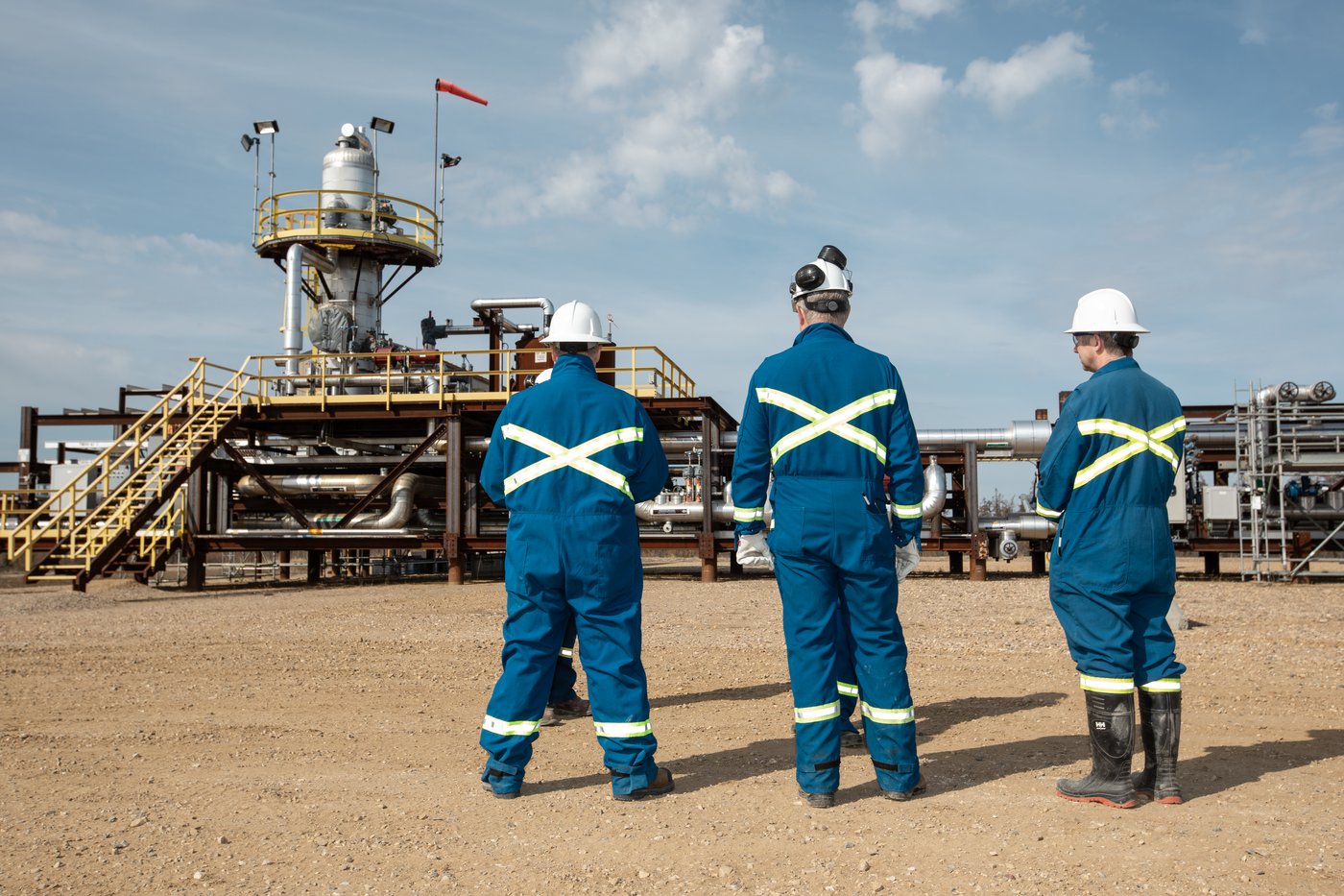 Workers at the Cenovus Christina Lake oilsands facility steam-assisted gravity drainage (SAGD) pad southeast of Fort McMurray, Alta., on Wednesday, April 24, 2024. THE CANADIAN PRESS/Amber Bracken