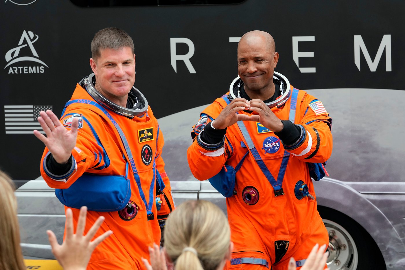 Mission Specialist Jeremy Hansen of Canada and pilot Victor Glover wave to family members as they leave the Operations and Checkout Building for a trip to Launch Pad 39-B and a planned liftoff on NASA's Artemis II moon rocket at the Kennedy Space Center on Wednesday, April 1, 2026, in Cape Canaveral, Fla. (AP Photo/Chris O'Meara)