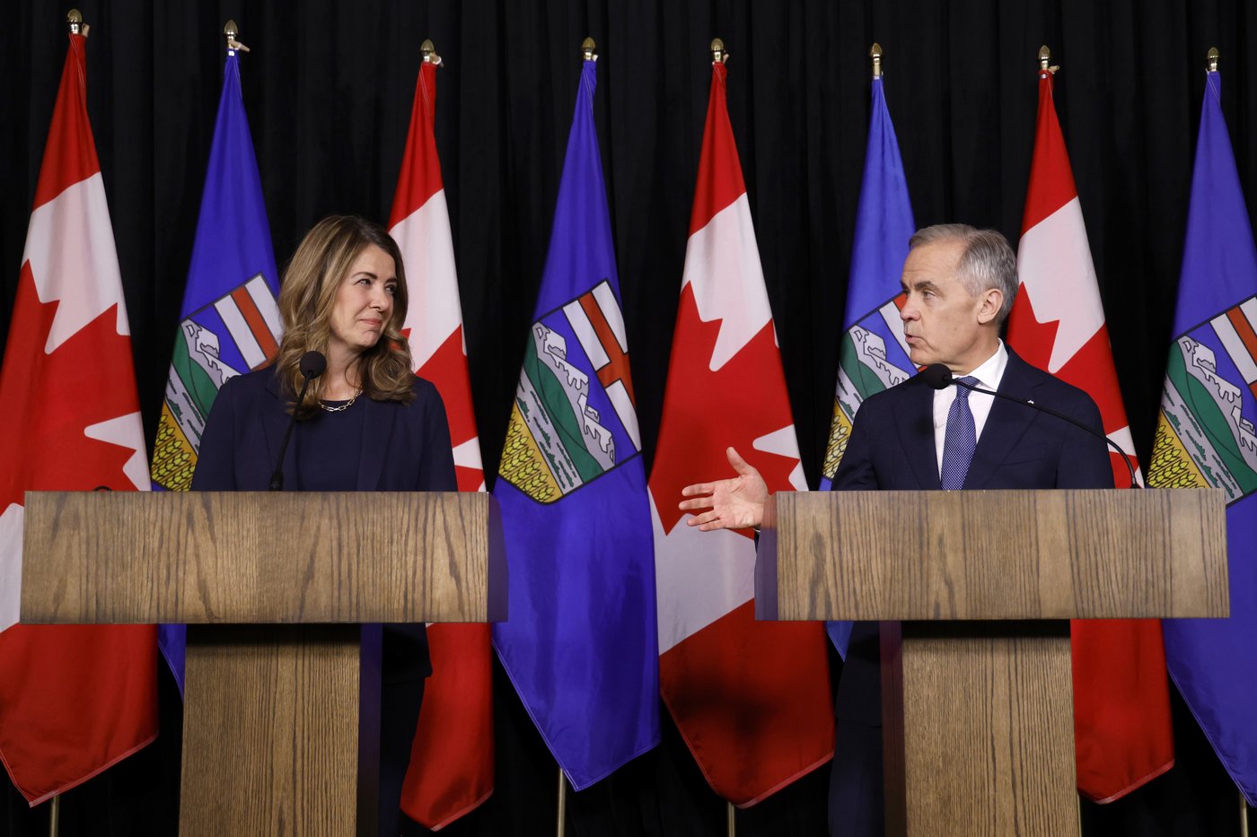 Prime Minister Mark Carney speaks alongside Alberta Premier Danielle Smith in Calgary, Friday, May 15, 2026. THE CANADIAN PRESS/Jeff McIntosh