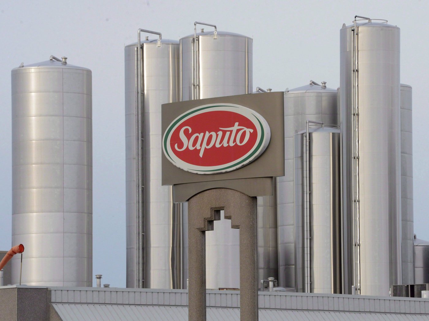 A sign at a Montreal Saputo plant is shown on Jan. 13, 2014. THE CANADIAN PRESS/Ryan Remiorz