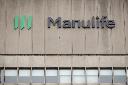 Signage is seen on Manulife Financial Corp.'s office tower in Toronto, Tuesday, Feb. 11, 2020. THE CANADIAN PRESS/Cole Burston
