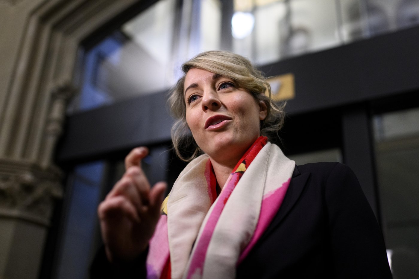 Industry Minister Melanie Joly speaks to reporters on Parliament Hill in Ottawa on Thursday, March 12, 2026. THE CANADIAN PRESS/Spencer Colby
