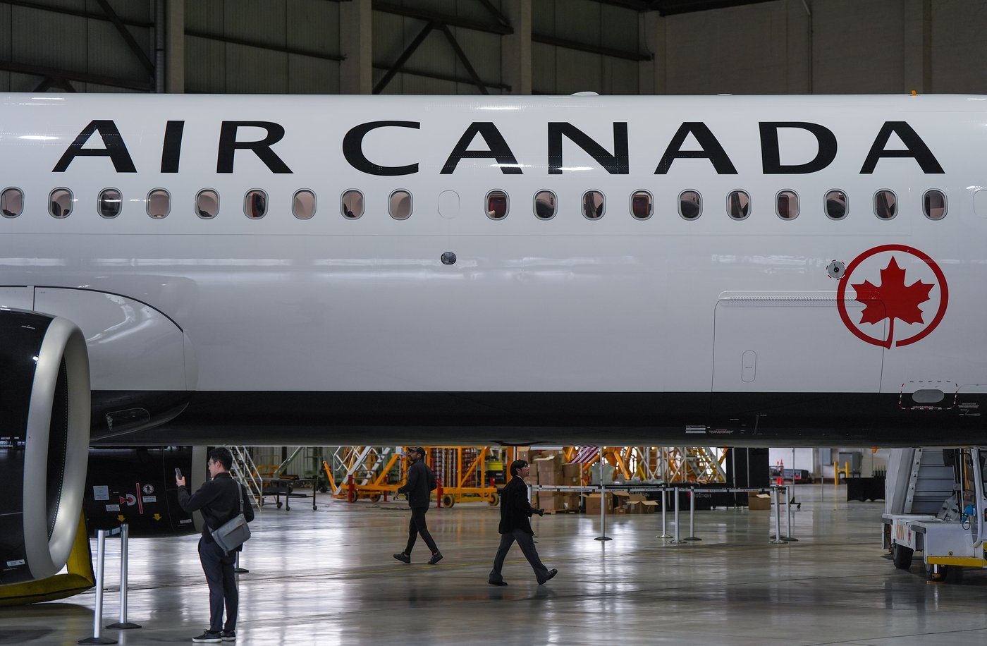 People walk around Air Canada's new Airbus A321XLR aircraft during a media preview at Vancouver International Airport, in Richmond, B.C., on Friday, June 5, 2026. THE CANADIAN PRESS/Darryl Dyck