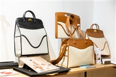 A group of purses on a shelfDescription automatically generated