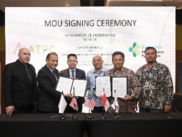 A group of people holding papersDescription automatically generated