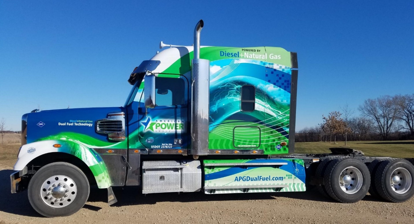 A picture containing truck, outdoor, sky, greenDescription automatically generated