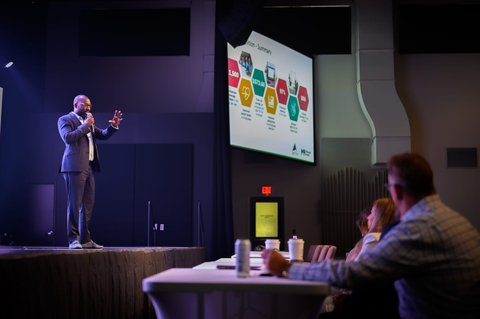 Managed Health's CEO, Mouhamet Seye, at a conference with other industry leaders. (Photo: Business Wire)