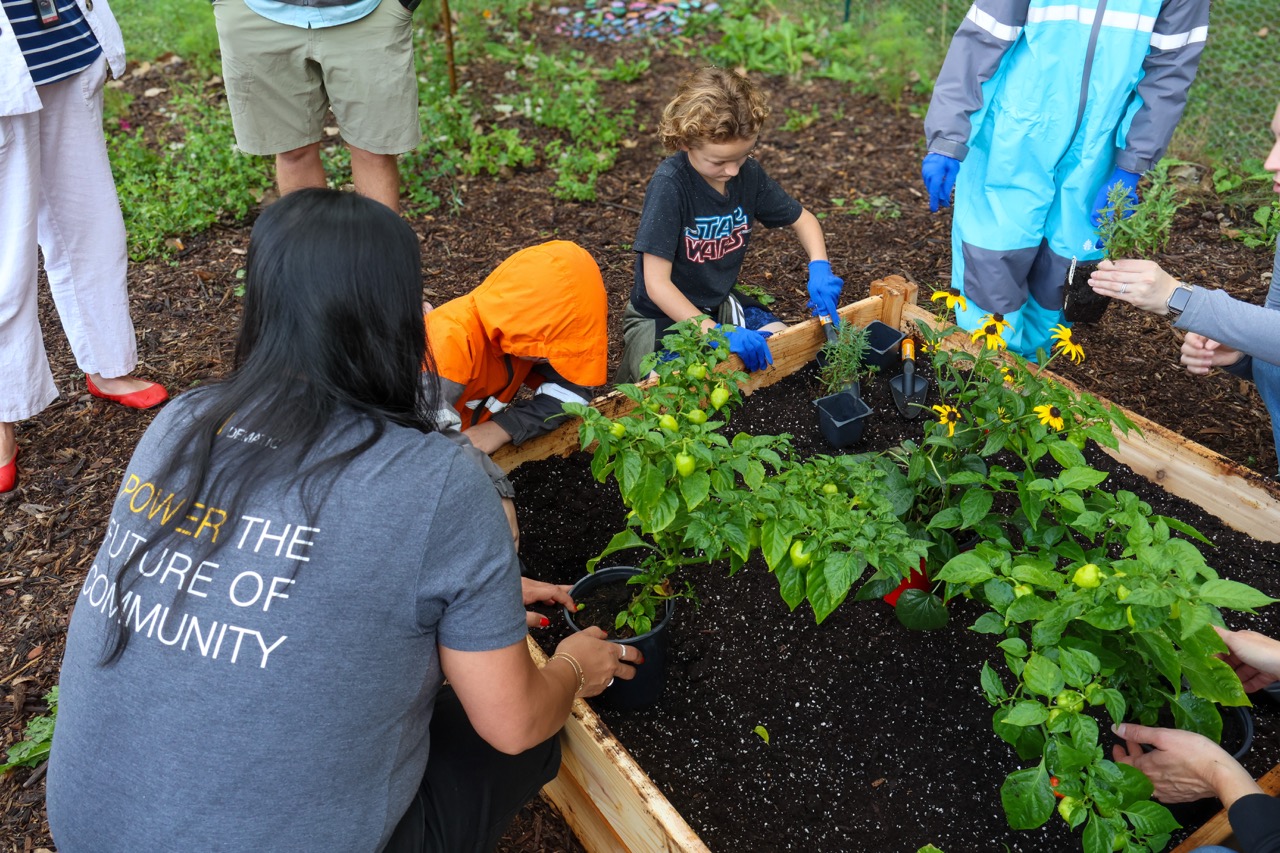 Dematic volunteers join students at PLG installation in Grand Rapids, Michigan.