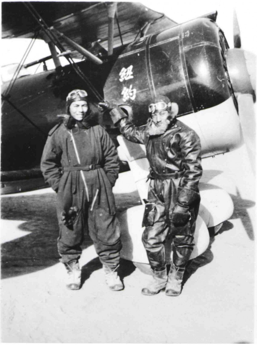 Art Chin (right), standing next to a Russian-built Polikarpov I-152 biplane fighter. (Photo: John Gong/disciplesofflight.com)