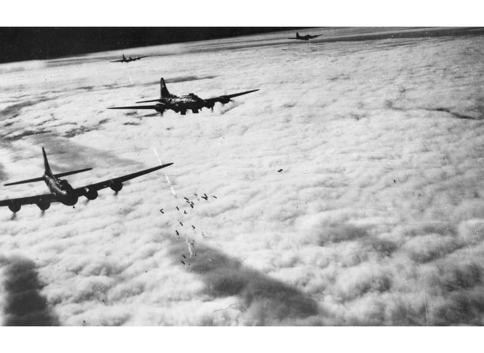 B-17s of the USAAF Eighth Air Force dropping bombs over a target in 1943. (Photo: Rob Wallace/National WWII Museum)