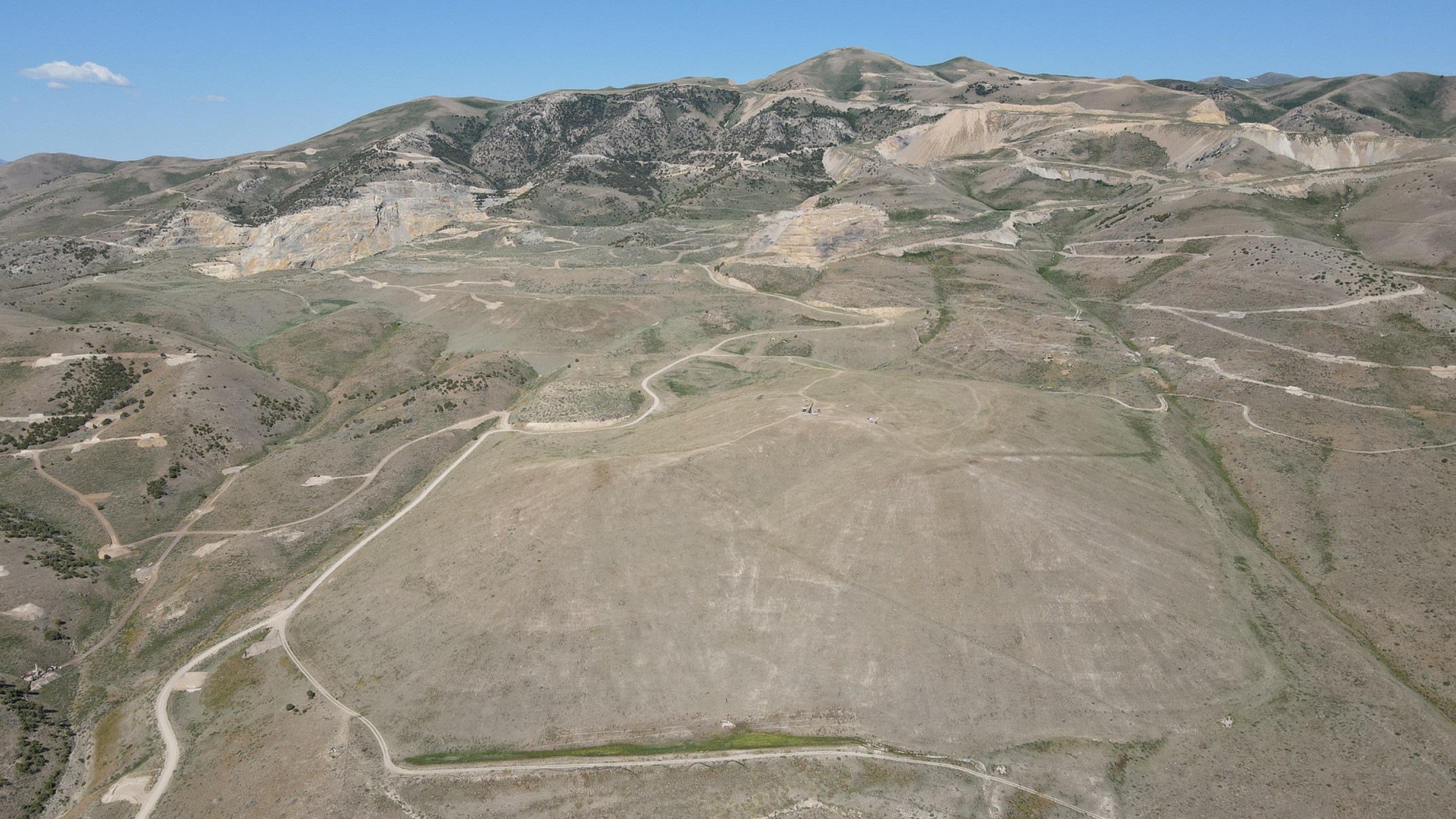 Looking west at a sonic drill rig on the Legacy Heap Leach Pad at Black Pine