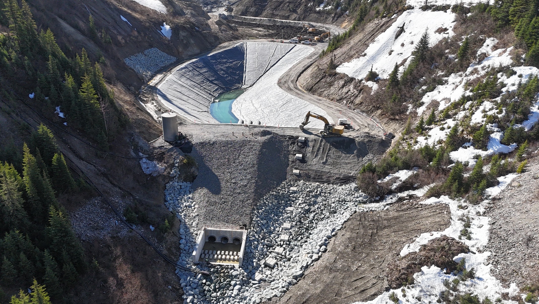 Sediment control pond (SCP) installed liner and placement of aggregates.