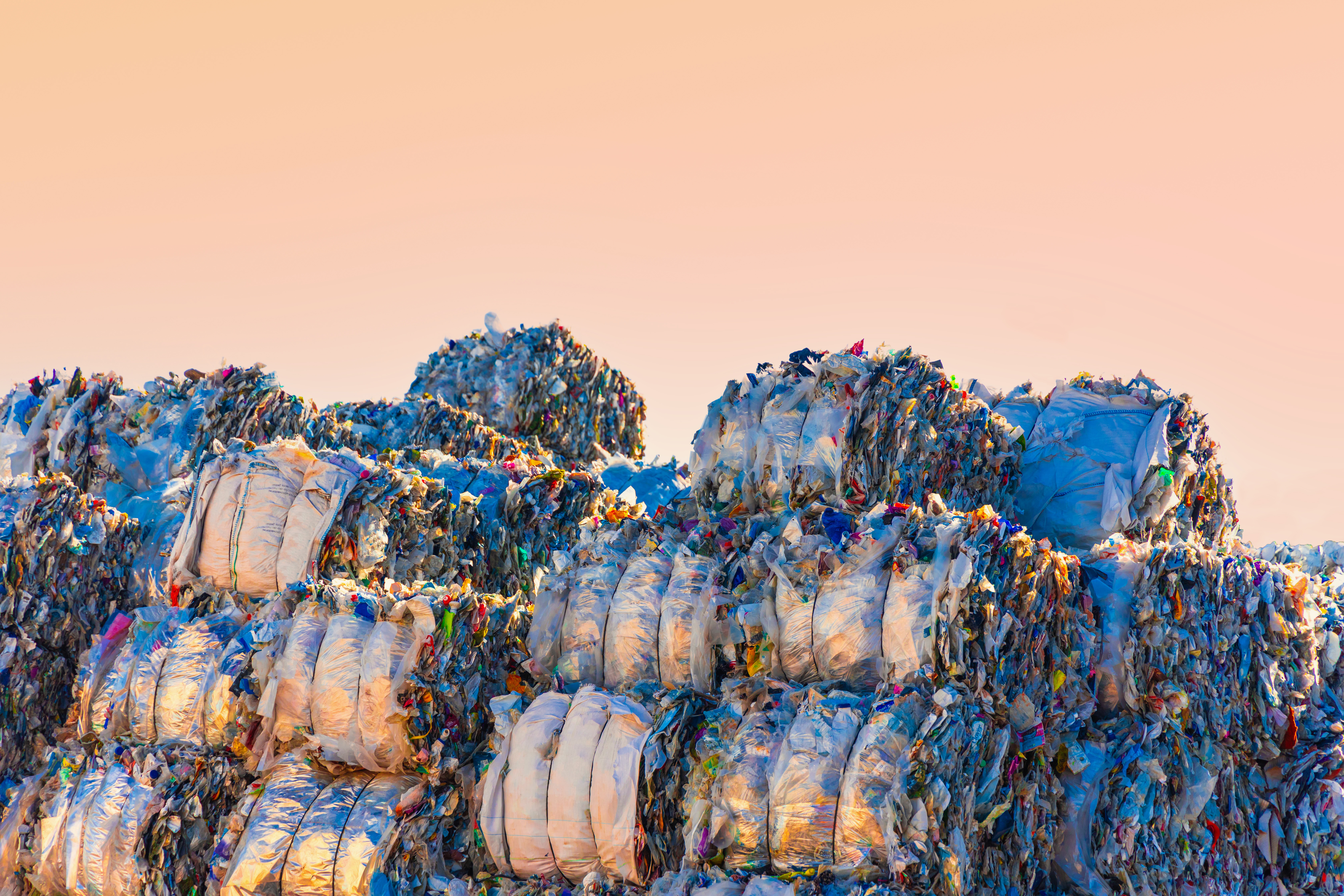 A large amount of plastic bales waiting in the outdoor of the recycling plant ready to be processed for a green circular economy with zero waste in Sp
