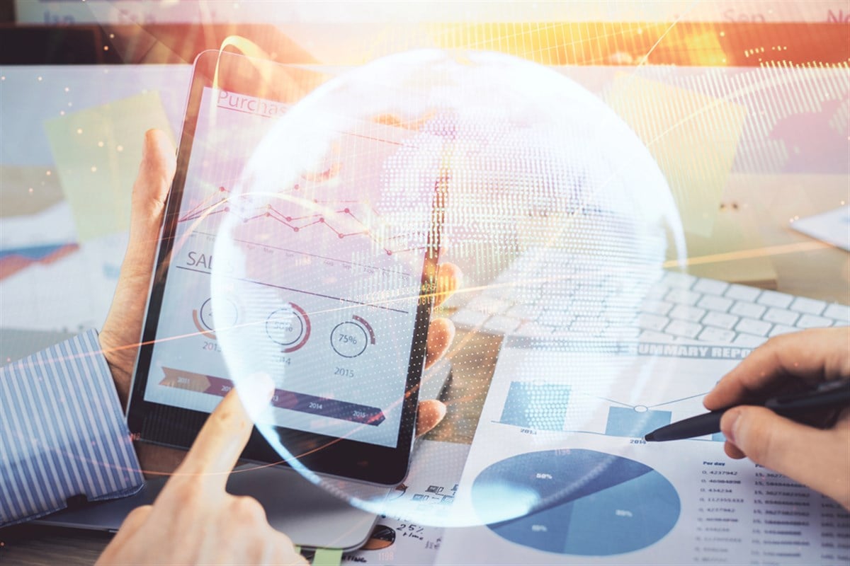 Double exposure of mans hands holding and using a phone and international business theme drawing.