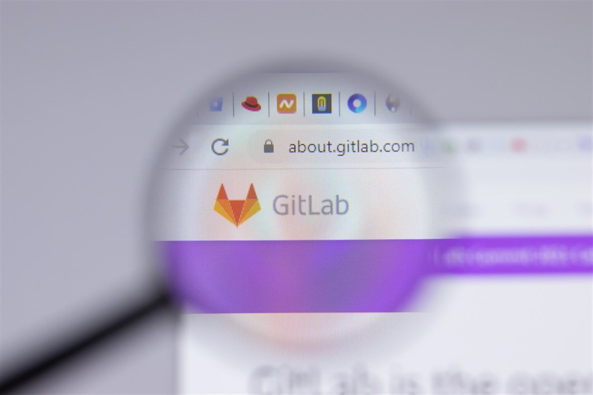GitLab logo under magnification on a webpage as investor sentiment weakens amid disappointing AI monetization and post-earnings stock decline.