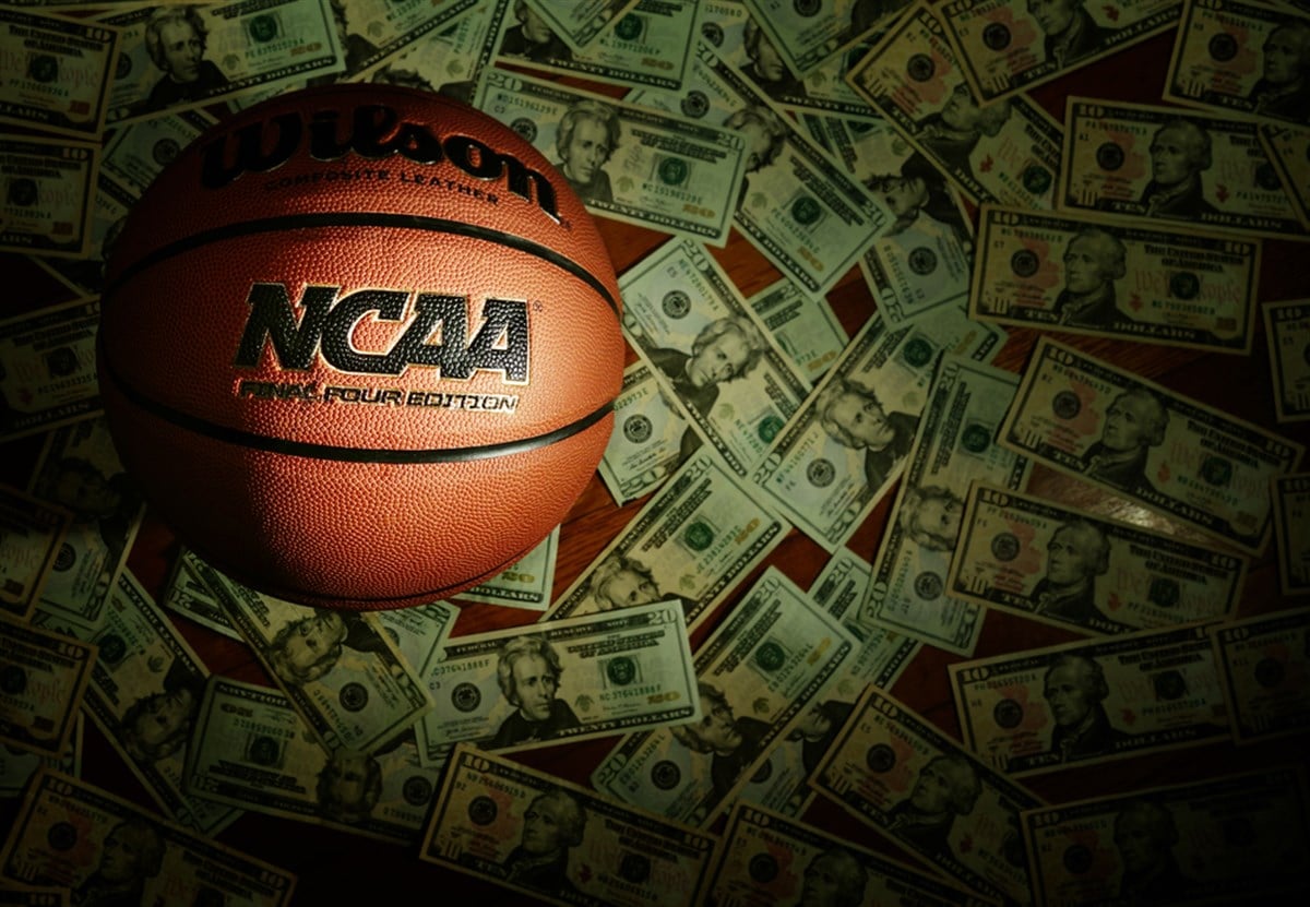 Eveleth, MN - USA - 03-08-2022: An NCAA Final Four Edition basketball surrounded by money