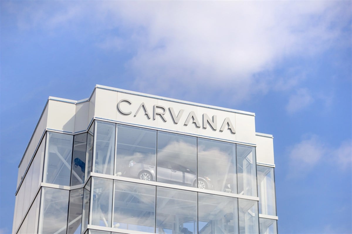 A closeup of the Carvana logo on a "vending machine" car dealership.