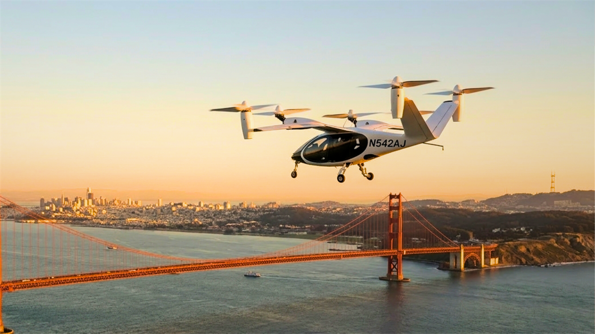 Joby Aviation eVTOL air taxi flying over the Golden Gate Bridge.
