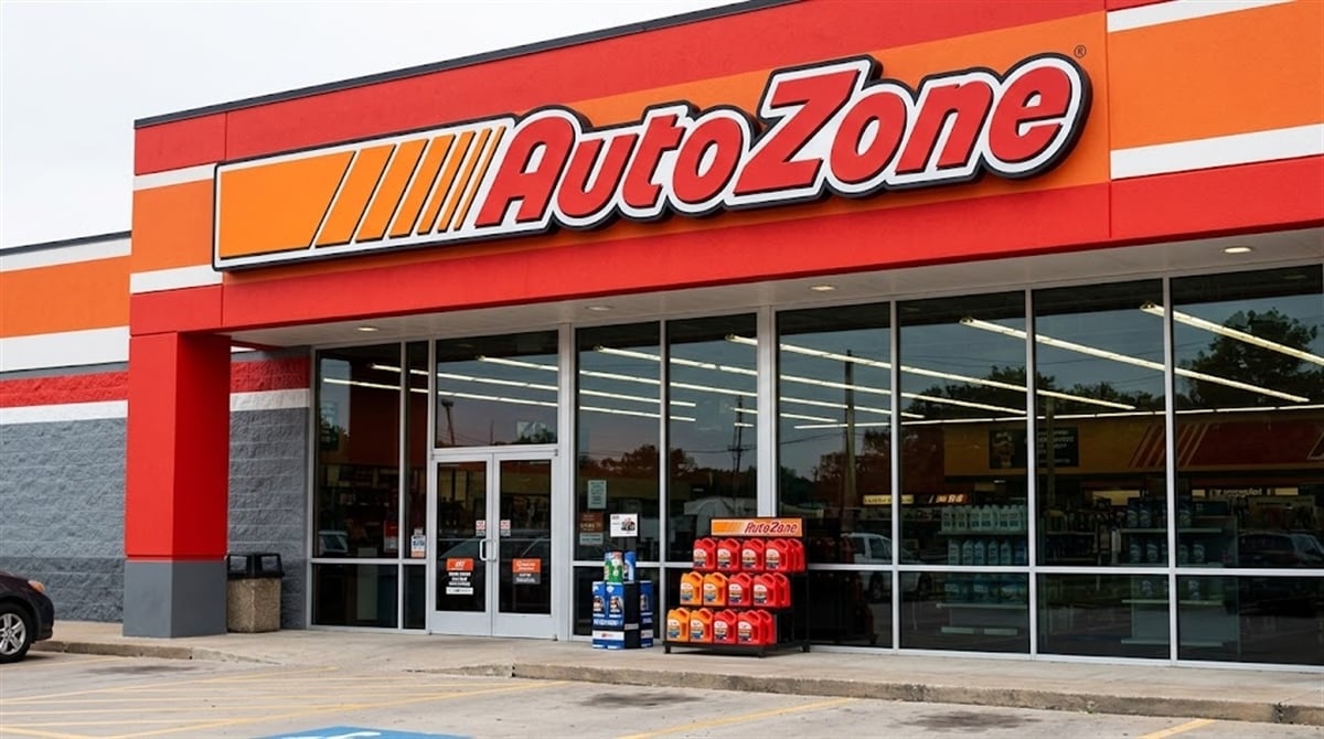 Exterior of an AutoZone retail store with motor oil products displayed near the entrance.