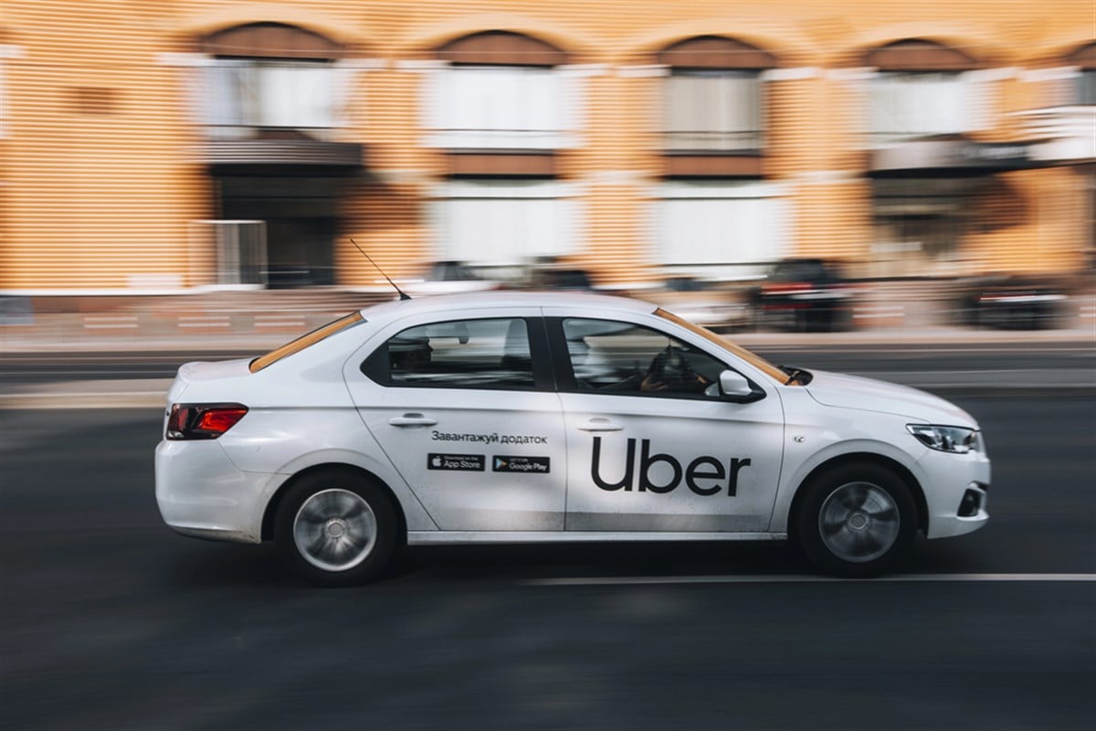 Uber company vehicle against blurred background