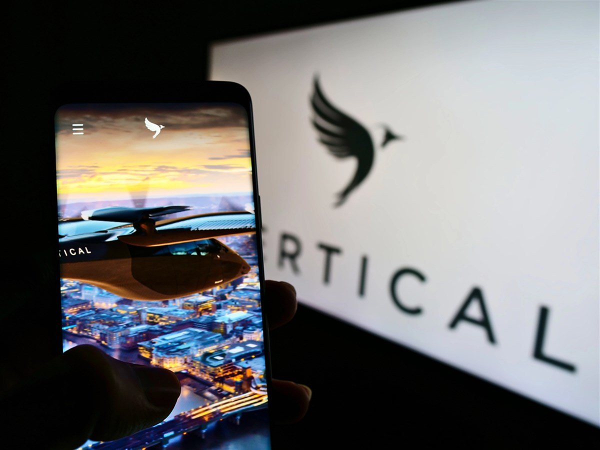 STUTTGART, GERMANY - Jun 14, 2021: Person holding smartphone with website of British aircraft company Vertical Aerospace Ltd. on screen with logo. Focus on center of phone display.