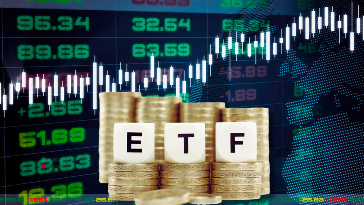 Stacked coins with ETF blocks and rising market chart, symbolizing growth and increasing investor demand for active exchange-traded funds.