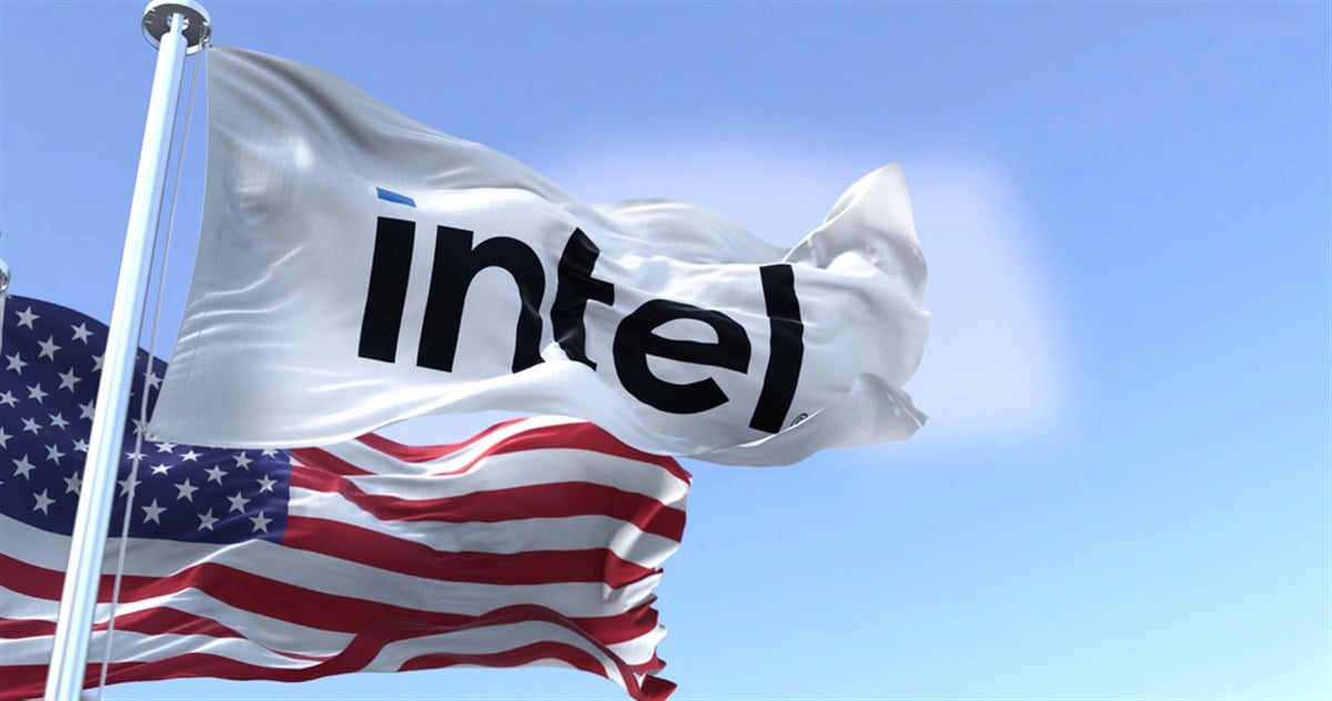 San Francisco, CA, USA, February 2022: The flag of Intel Corporation waving in the wind with the national flag of the United States of America. Intel is an American multinational corporation and technology company — Stock Editorial Photography