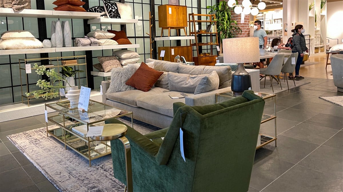 Orlando, FL USA- March 6, 2021 : A couch , chair and tables display at a West Elm Midcentury Modern furniture store in Orlando, Florida.